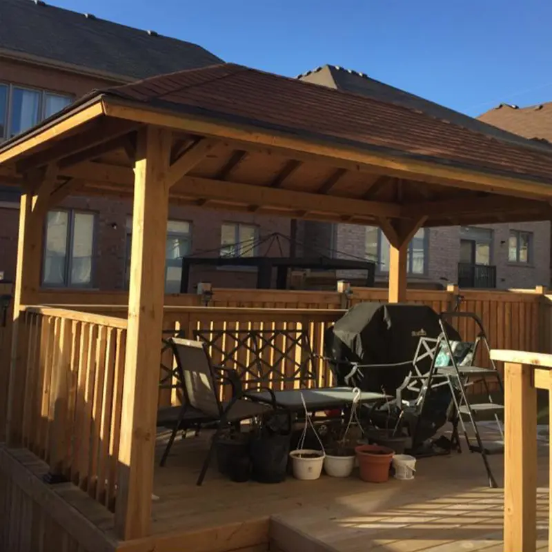 Covered backyard deck with timber roof structure built by Megapol Deck in GTA.