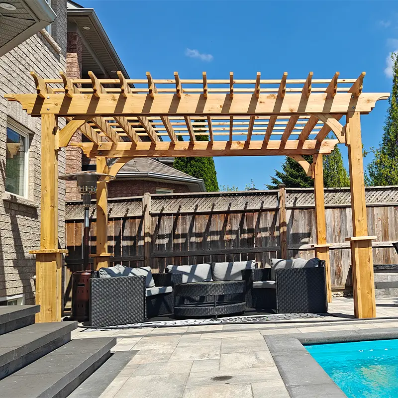 Custom cedar pergola installation by Megapol Deck in GTA backyard with interlock patio and poolside seating area.