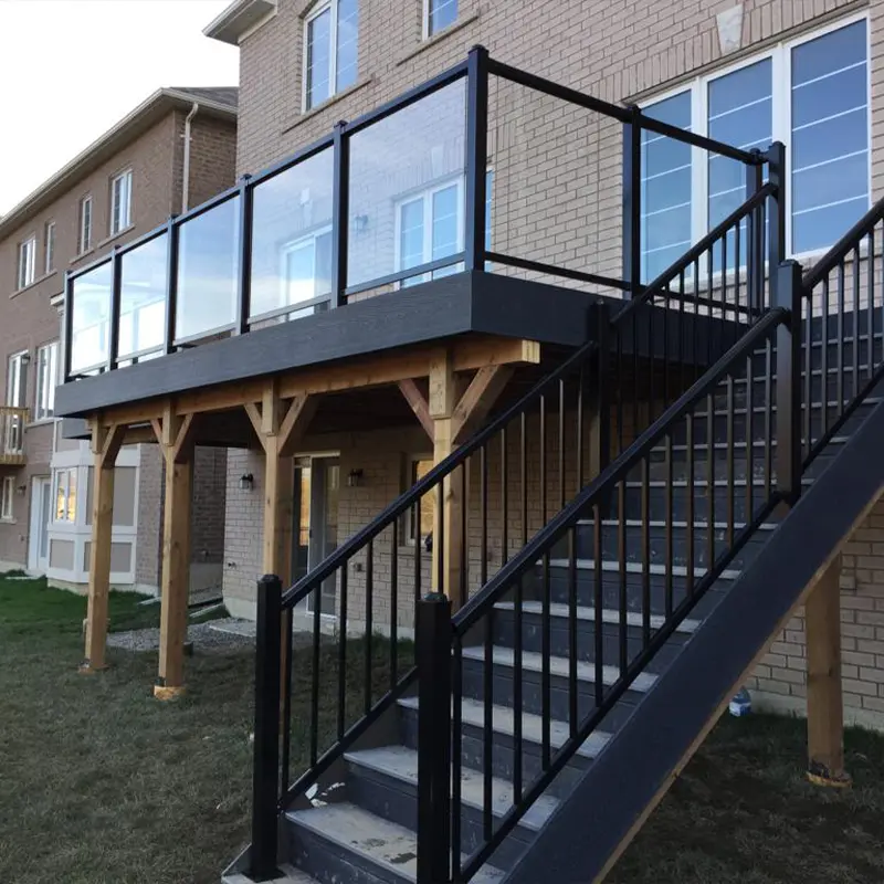 Custom covered patio with timber posts and outdoor fireplace built by Megapol Deck in GTA backyard.
