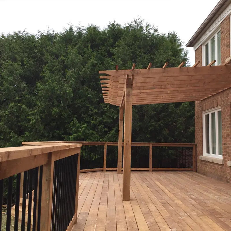 Custom deck gate and black aluminum railing system installed by Megapol Deck in GTA backyard.