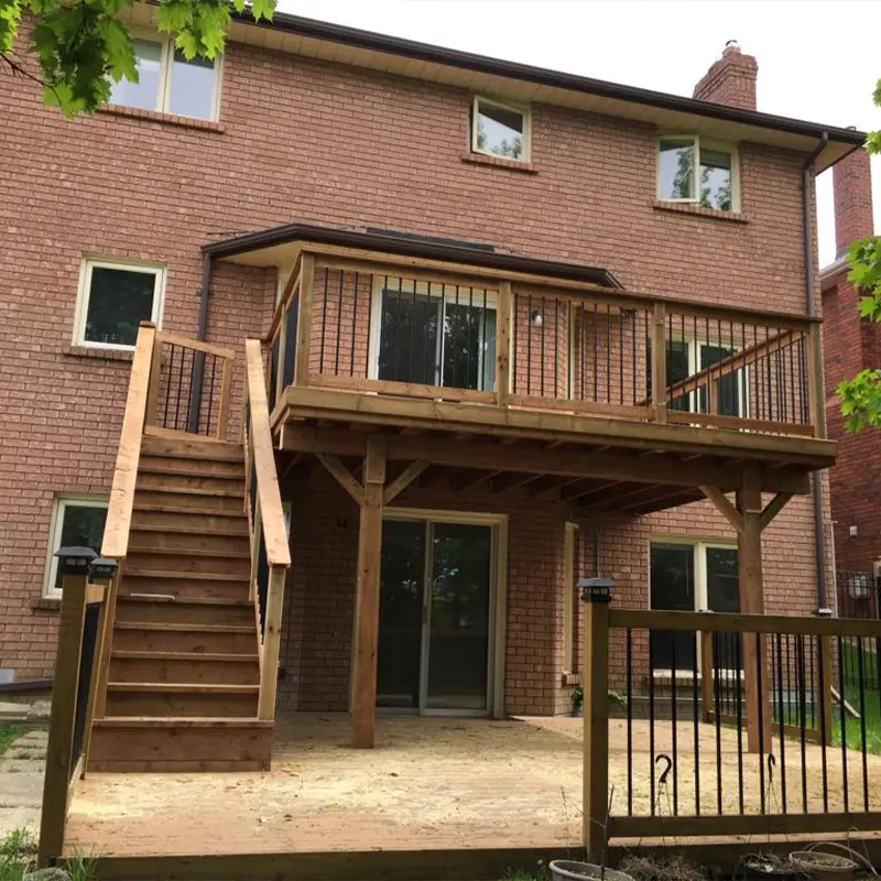 Custom second-story deck with pressure-treated lumber and metal balusters built by Megapol Deck in GTA.