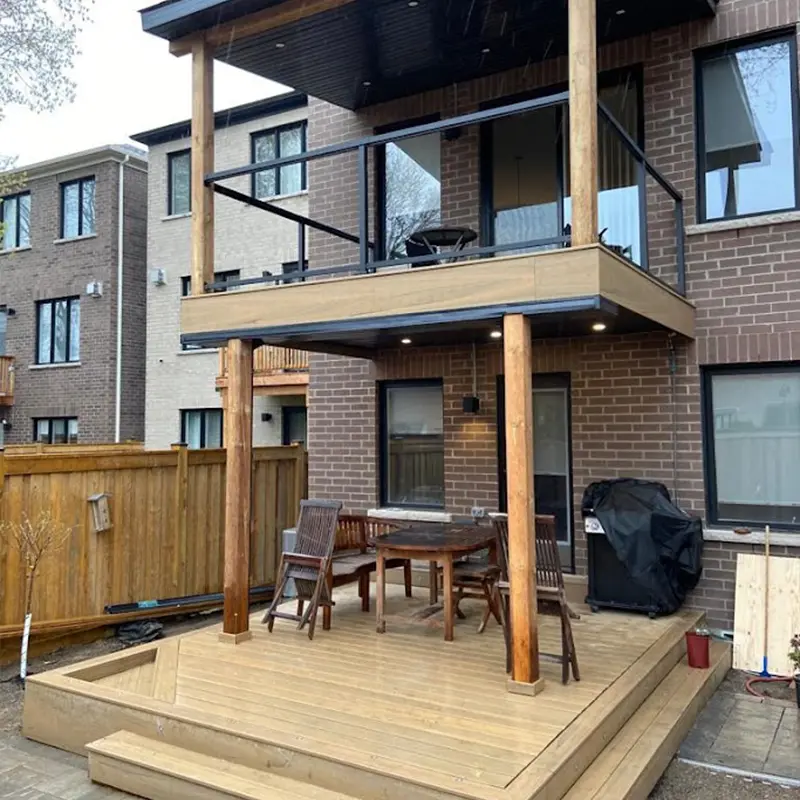 Elevated covered deck with glass railing and timber posts built by Megapol Deck in GTA.