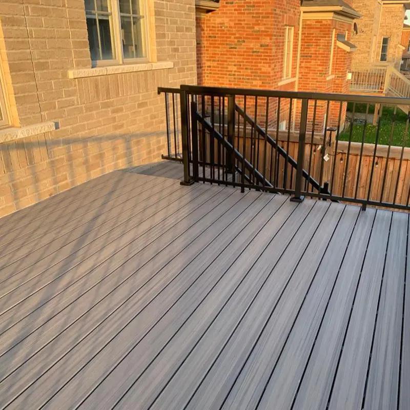 Grey composite deck with metal railing installed by Megapol Deck for GTA homeowners.