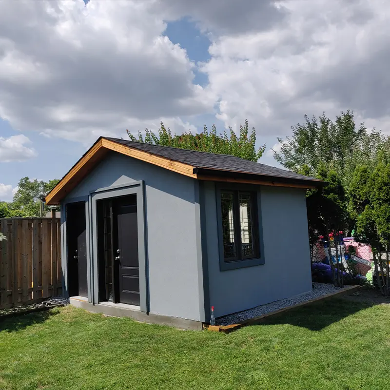 Modern backyard shed and cabana built by Megapol Deck in GTA with finished exterior and shingle roof.