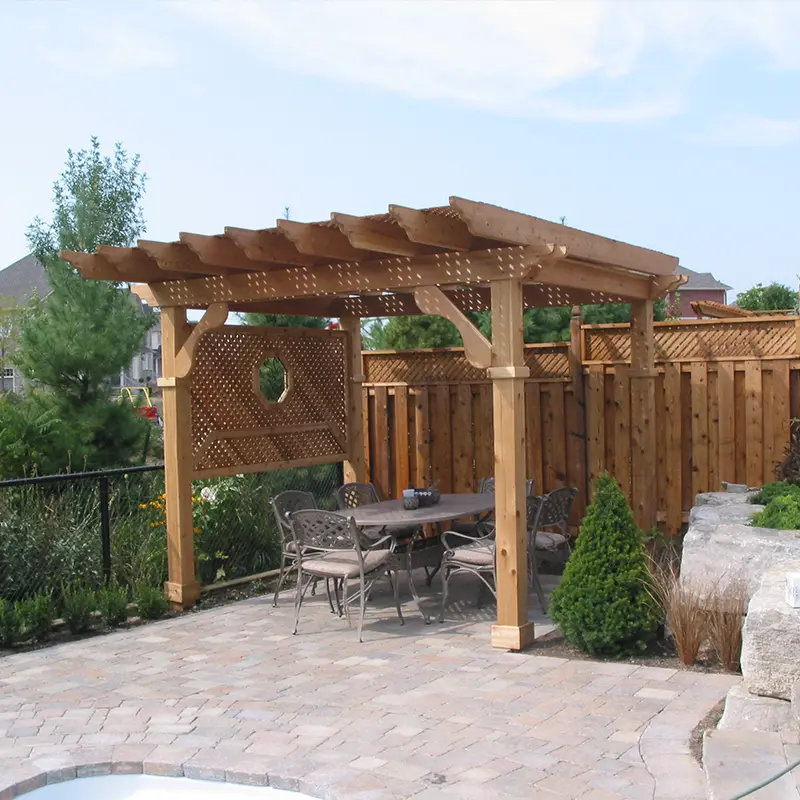 Pressure-treated wood pergola built by Megapol Deck over interlock patio with privacy fence in GTA.