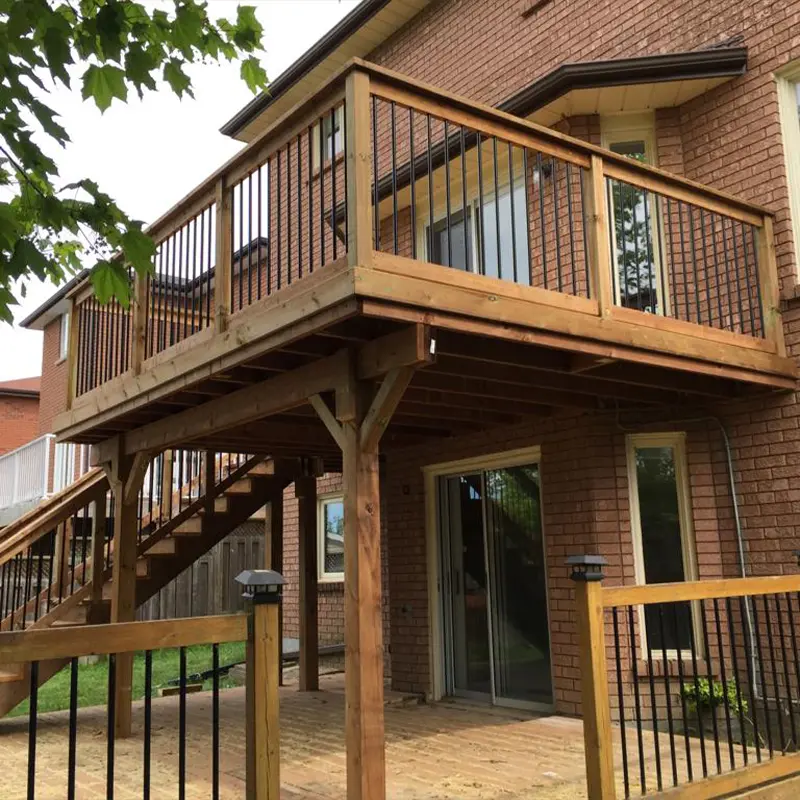 Raised backyard wood deck with black aluminum railing and staircase installed by Megapol Deck in GTA.