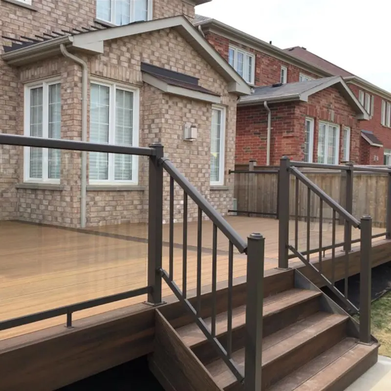 Second-story deck with black aluminum railing and staircase installed by Megapol Deck in GTA.