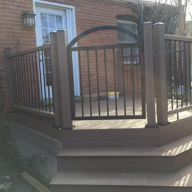 Spacious raised deck with black railing installed by Megapol Deck in GTA suburban home.